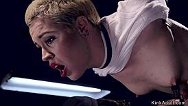 Blonde slave gets caned in doggy bondage