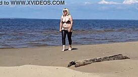 Big Leather Ass Walks on Beach in Heels