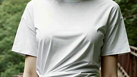 I stand in my underwear on a bridge in the woods