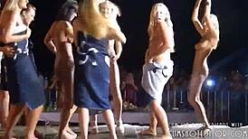 Are these blondes stripping naked at the beach party?