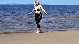 Big Leather Ass Walks on Beach in Heels