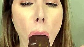 paige in fishnets takes big black cock dildo deep, then finishes with her mouth in an intriguing scene