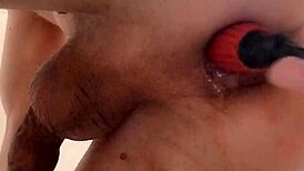 My prolapse leaks natural lubricant while I squirm from intense anal stretching!