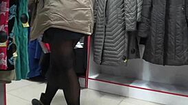 A hidden camera in a fitting room admires a juicy pawg and peeping for legs in a public mall voyeur fetishist