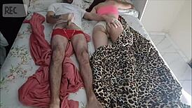 Old man lies to share bed with young visitor for taboo handjob.
