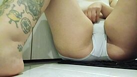 I touch my tattooed body in the office bathroom