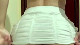 curly haired hot girl dancing funk in mini skirt with anal plug