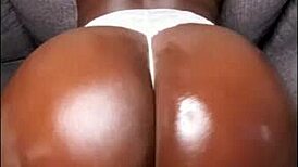 big oiled booty twerks teasingly with and without thong