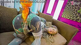 tattooed girl in fishnets and heels plays with toys solo