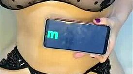 She rides in black lingerie, ass bouncing with low moans, filming from behind.