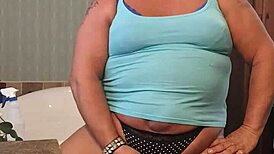 darcy cums at home, her suggestive actions hinting at deeper pleasures and intimate moments.