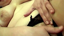 This brunette slut fingers her pussy with a dildo while watching porn