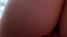 young brunette using a big pink dildo