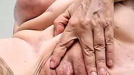 Mature woman reveals enticing striptease and intimate toy play up close.