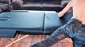 Stretching in compression pants on massage table