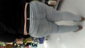 Filming the chubby woman shopping at the supermarket casually