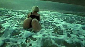 blonde teases with tits then drops for public beach cock suck