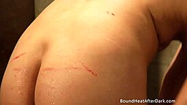 naked blonde lesbian slave bound in bath punished by licking dom mistress ass