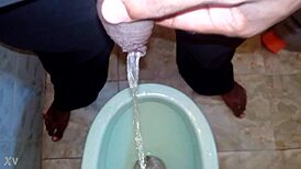 boy pees while black man watches intense urination scene