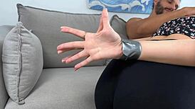 Mom's bound friend eagerly sucks cock while moaning deeply