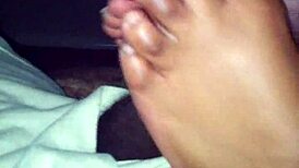 ebony babe strokes black cock with her sexy feet