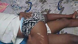 Curvy ebony girlfriend with big natural tits shakes ass while getting spanked in bedroom