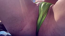 Horny Italian milf flashes tight shaved pussy at Miami public beach