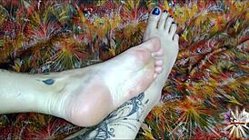 i oil up my tattooed feet and stroke your cock with perfect footjob grips