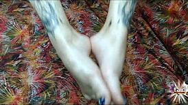 i oil up my tattooed feet and stroke your cock with perfect footjob grips