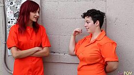 cuffed redhead squirms as brunette lesbian licks her pussy and anal deeply