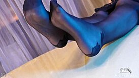 Sexy pantyhose goddess teases feet in rose print heels close-up