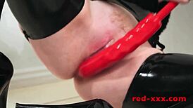 redhead milf teases in latex stockings while fingering shaved pussy slowly