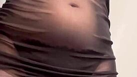 goddess ellie rowyn dances teasing in sheer dress shakes huge tits belly