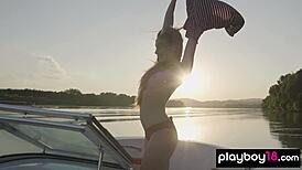 Clara strips naked on boat flashing big natural tits and shaved pussy