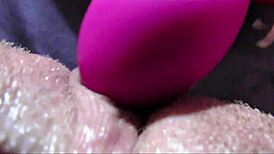 Intense zoom on swollen clit pulsing through massive squirt from vibrator play
