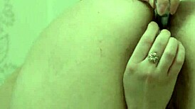 Brunette crams small bottle into hairy pussy and anal double penetration in white socks